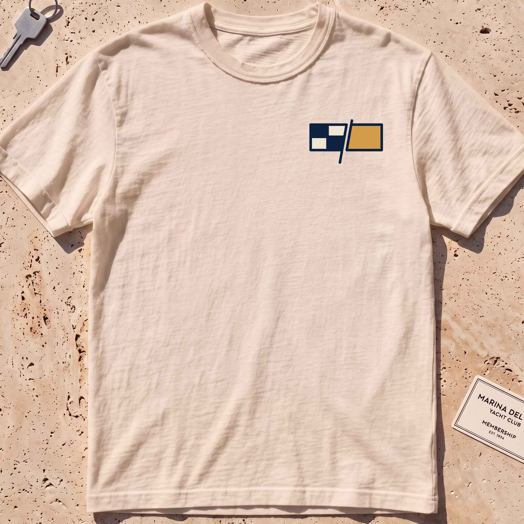 ivory heavyweight tee with a pair of maritime signal flags crest graphic.