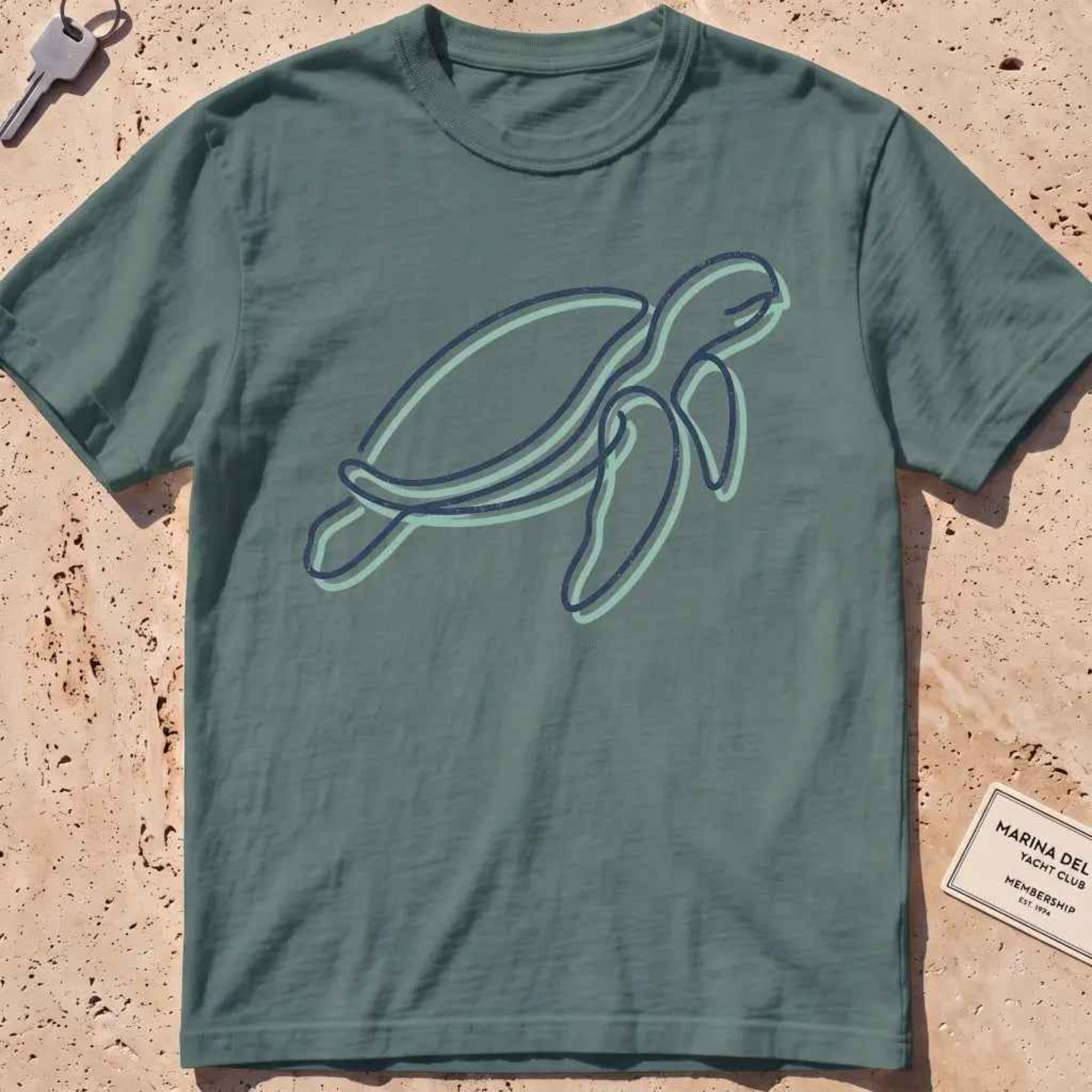 blue spruce heavyweight tee with a single continuous-line sea turtle graphic.