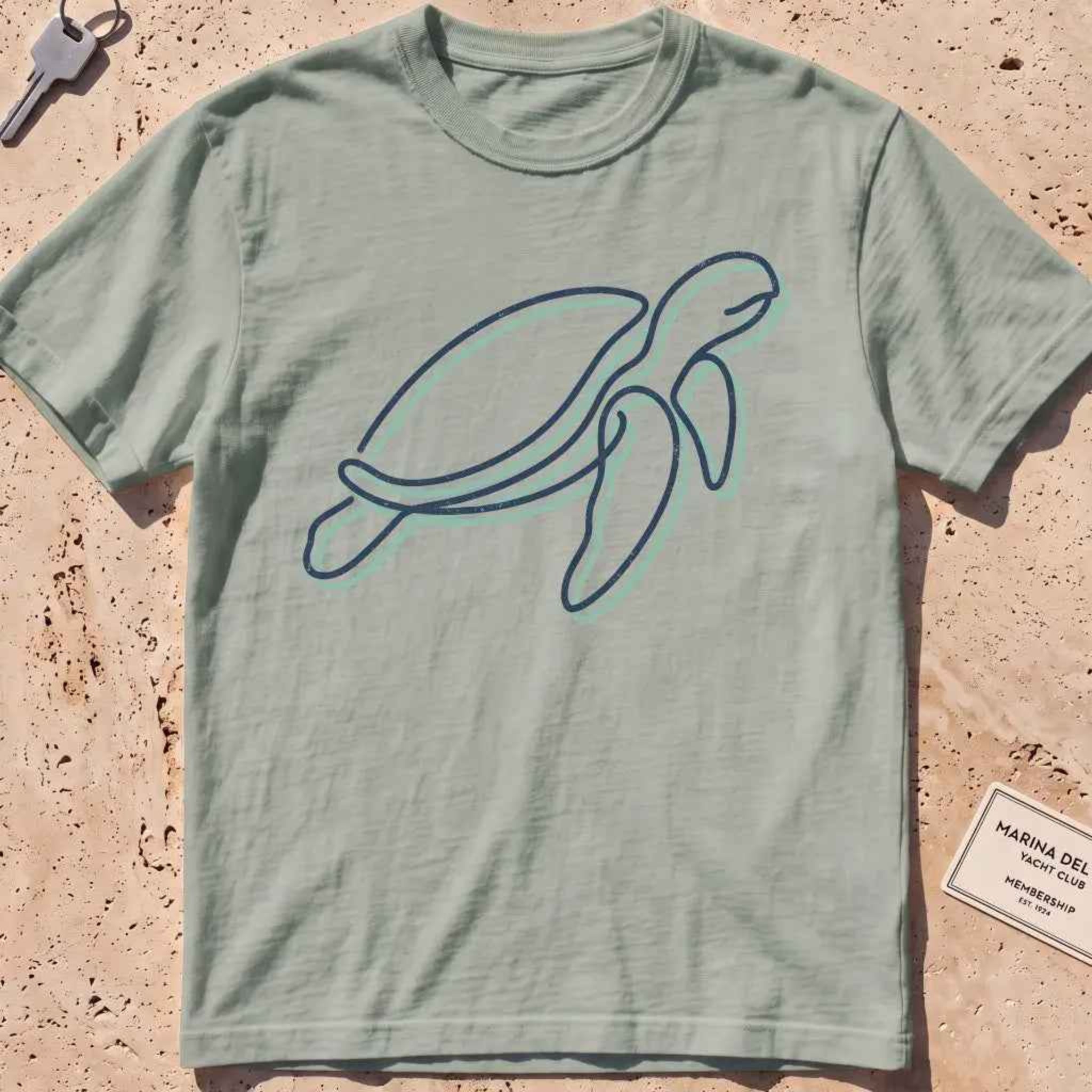 bay heavyweight tee with a single continuous-line sea turtle graphic.