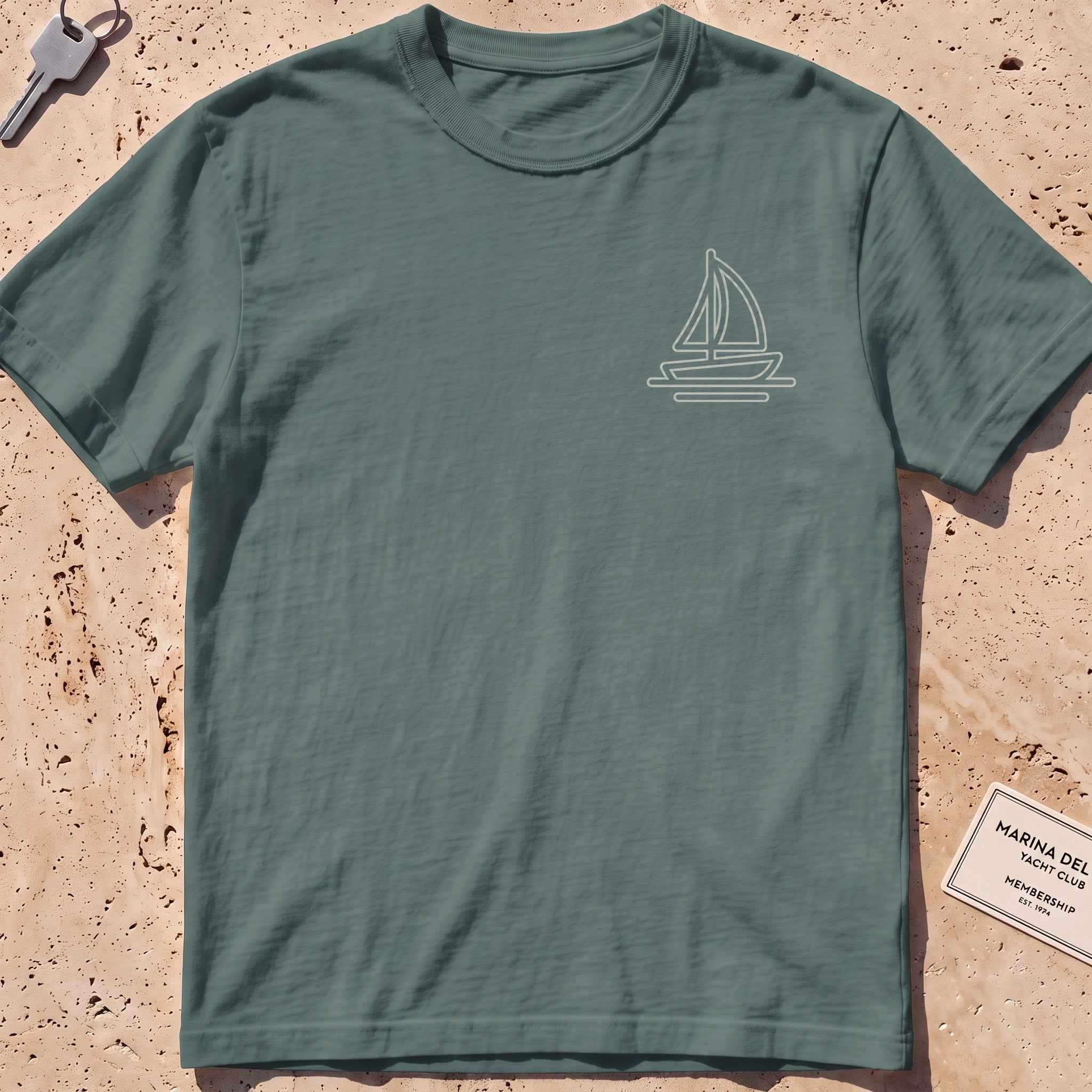blue spruce heavyweight tee with a single-line lone sail crest graphic.