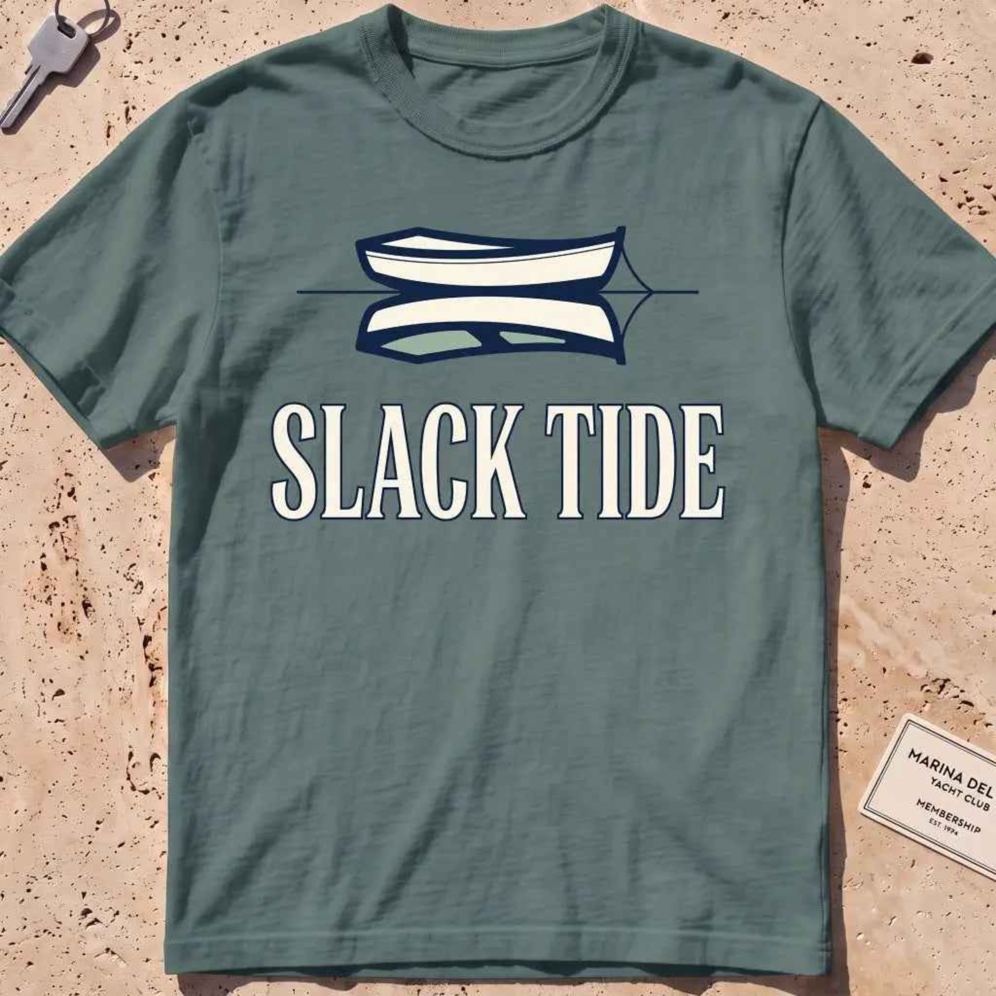 blue spruce heavyweight tee with a moored dinghy and still-water reflection graphic.