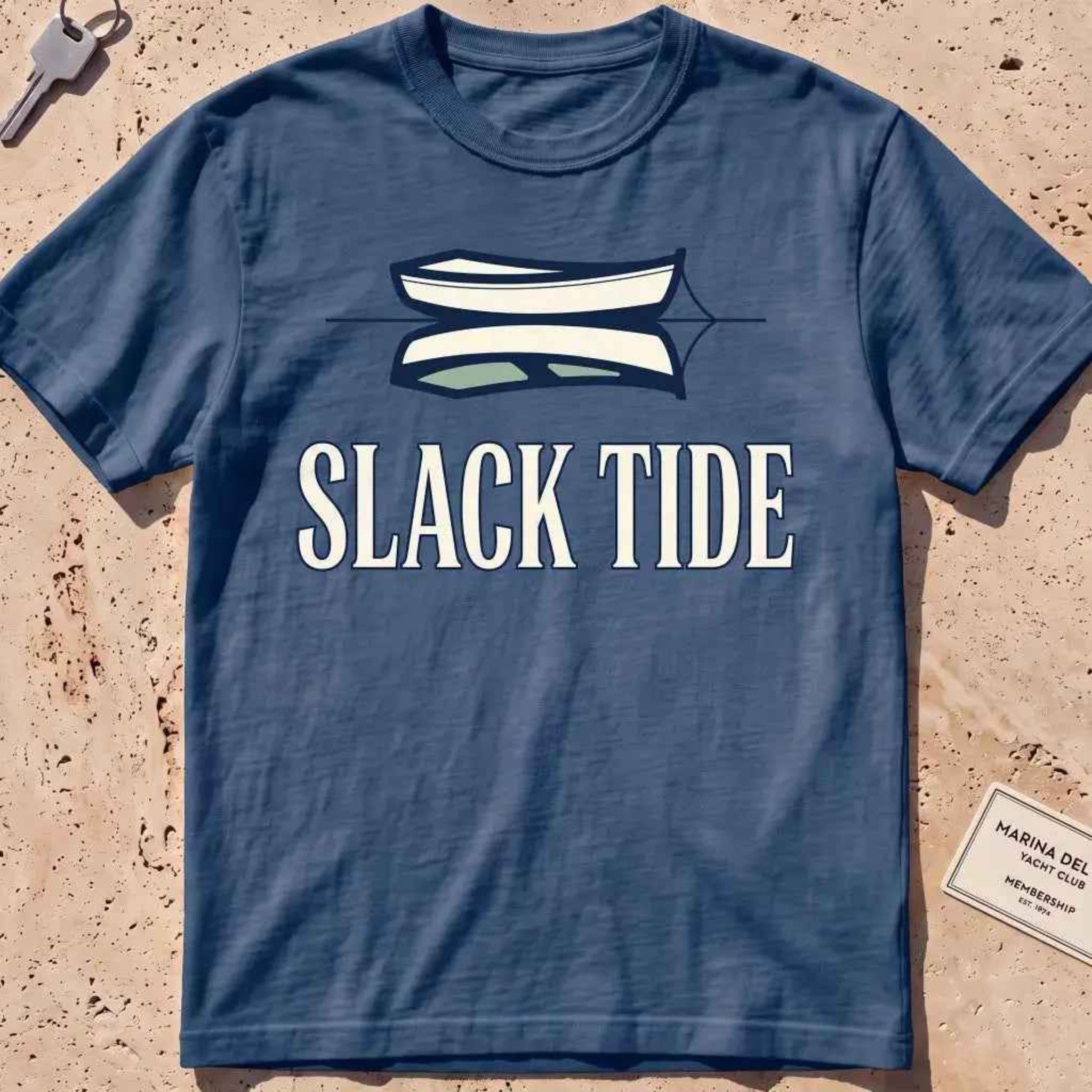midnight heavyweight tee with a moored dinghy and still-water reflection graphic.