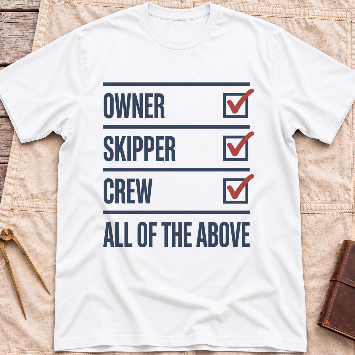 Front view of the white All of the Above T-Shirt with a checklist of Owner, Skipper and Crew, each ticked in red, above All of the Above.