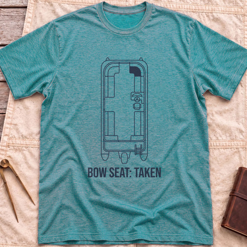 Front view of the heather galapagos blue Bow Seat T-Shirt with a top-down outline of a boat's deck layout, one front seat shaded, above the words Bow Seat: Taken.