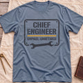 Front view of the heather indigo Chief Engineer T-Shirt with a stencil-style plate reading Unpaid, Unretired above a wrench.