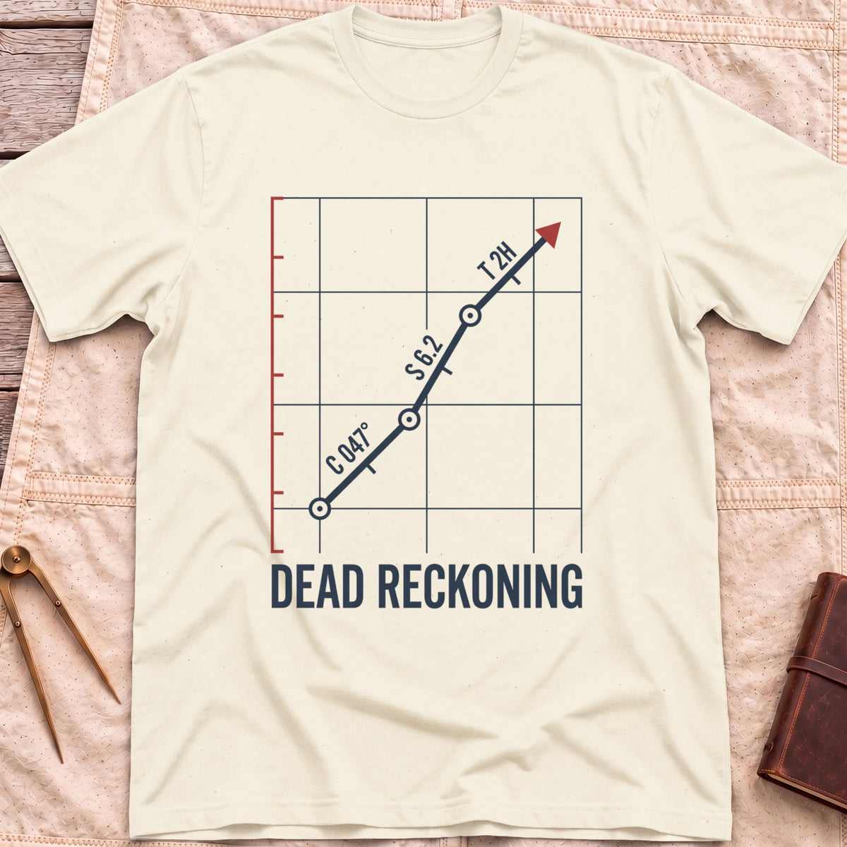 Front view of the natural Dead Reckoning T-Shirt with a gridded plot showing a course line marked C 047°, S 6.2 and T 2H ending in a red arrow.