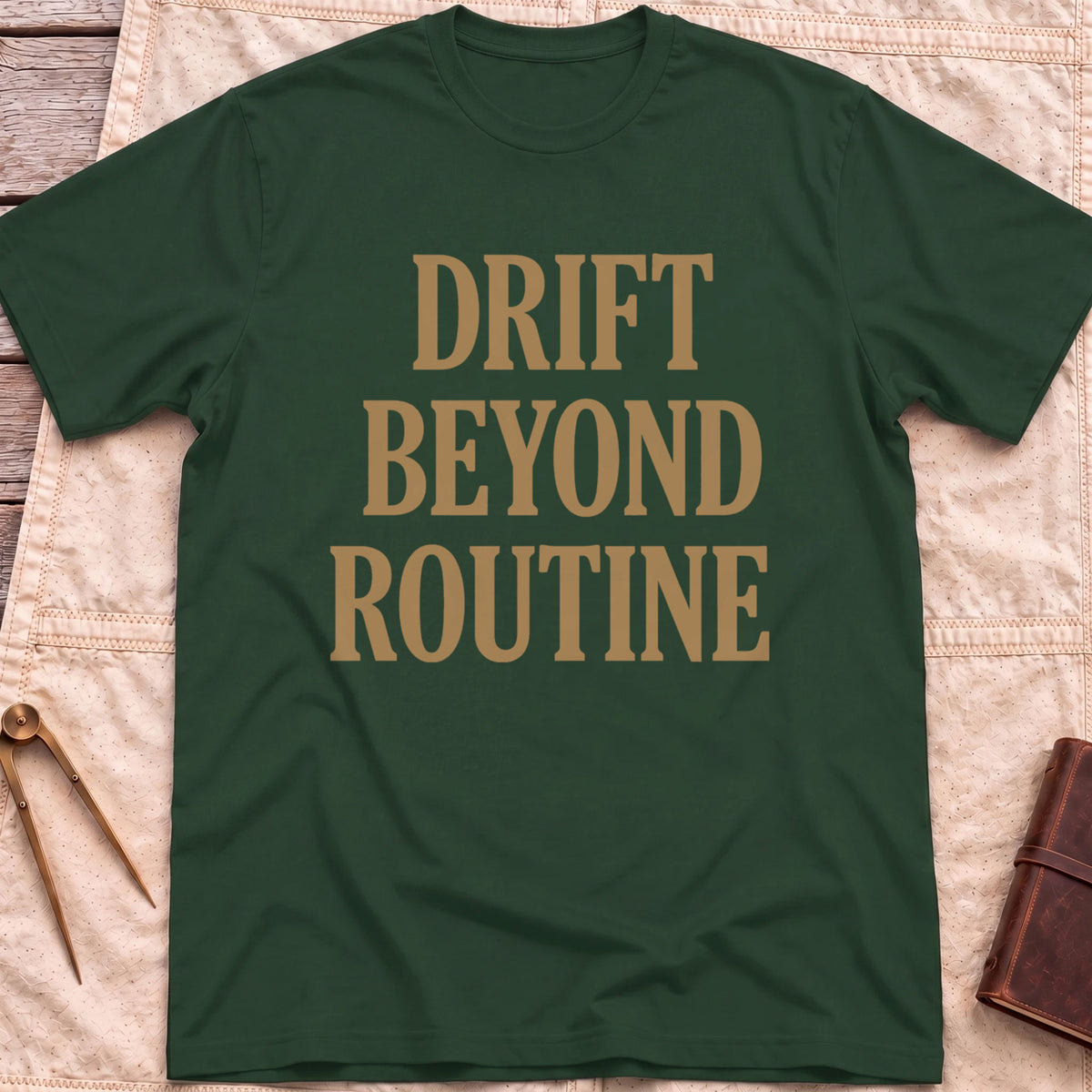 Front view of the forest green Drift Beyond Routine T-Shirt with the words Drift Beyond Routine in large tan capitals.