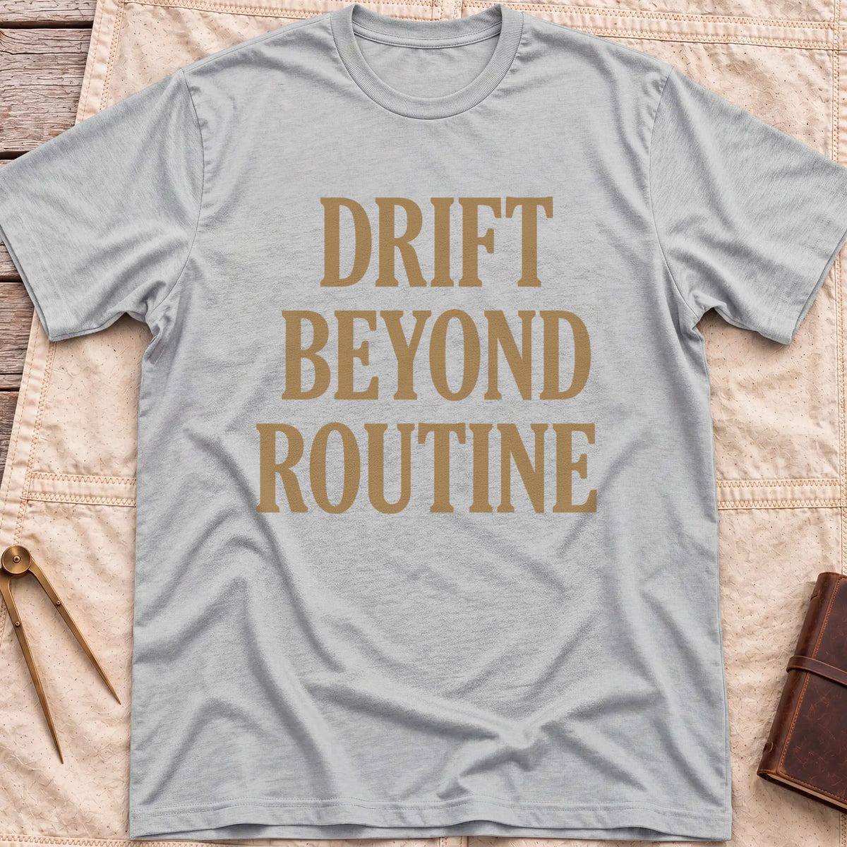 Front view of the sport grey Drift Beyond Routine T-Shirt with the words Drift Beyond Routine in large tan capitals.