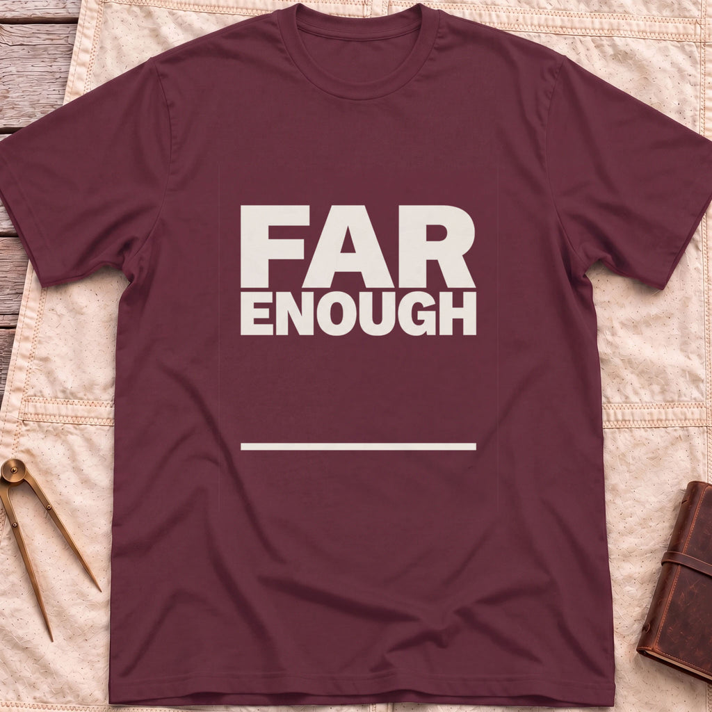 Front view of the maroon Far Enough T-Shirt with the words Far Enough in bold block capitals above a single line.