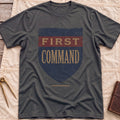 Front view of the dark heather First Command T-Shirt with a distressed navy shield and a red band, lettered First Command.