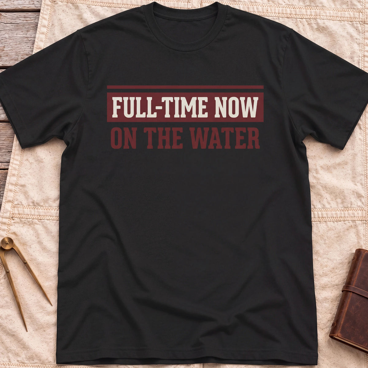 Front view of the black Full Time Now T-Shirt with the words Full-Time Now, On the Water in bold block lettering.