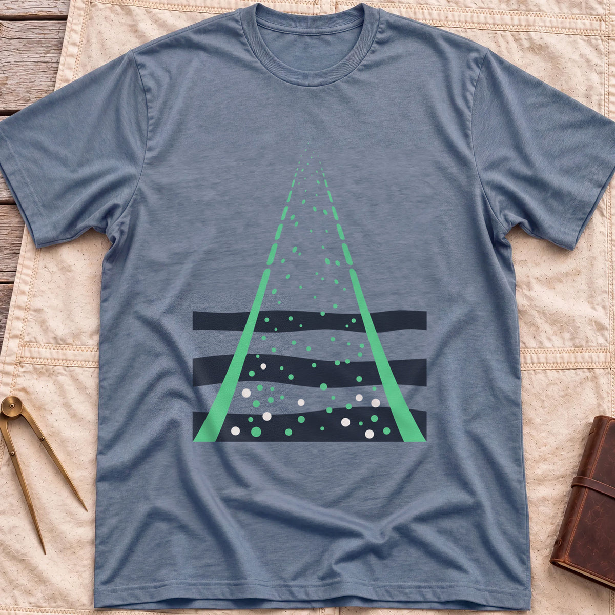 Front view of the heather indigo Green Fire T-Shirt with two green beams converging upward through scattered dots over dark wave bands.