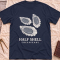 Front view of the navy Half Shell T-Shirt with three detailed oyster shells above the words Half Shell, Chesapeake.