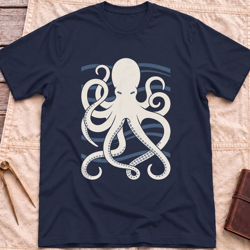 Front view of the navy Holdfast T-Shirt with a cream octopus spreading curling tentacles over blue wave lines.