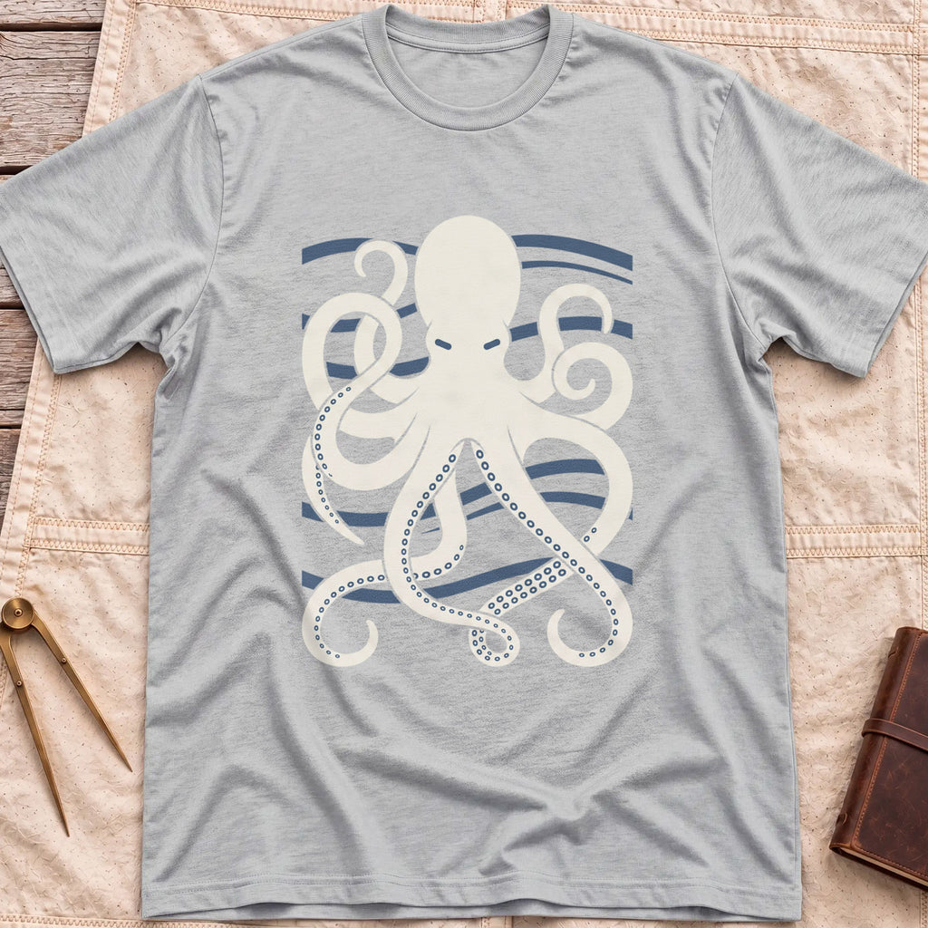 Front view of the sport grey Holdfast T-Shirt with a cream octopus spreading curling tentacles over blue wave lines.