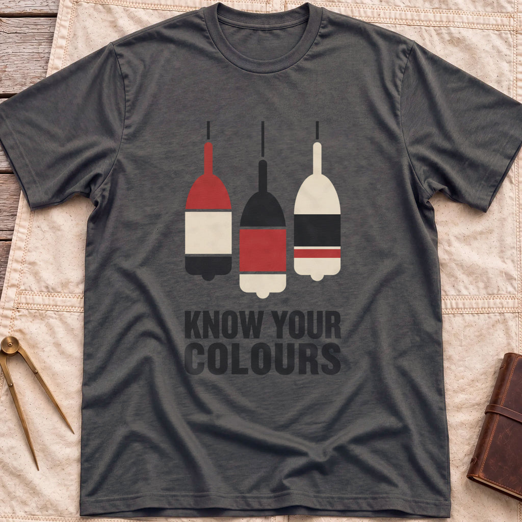 Front view of the dark heather Know Your Colours T-Shirt with three hanging buoys painted in red, black and cream bands above the words Know Your Colours.