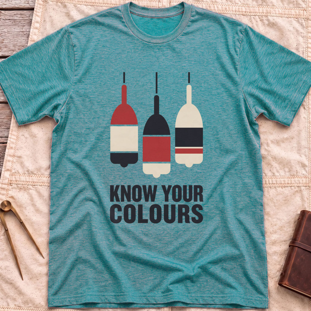 Front view of the heather galapagos blue Know Your Colours T-Shirt with three hanging buoys painted in red, black and cream bands above the words Know Your Colours.