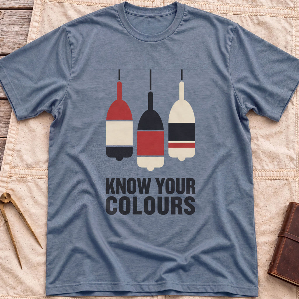 Front view of the heather indigo Know Your Colours T-Shirt with three hanging buoys painted in red, black and cream bands above the words Know Your Colours.
