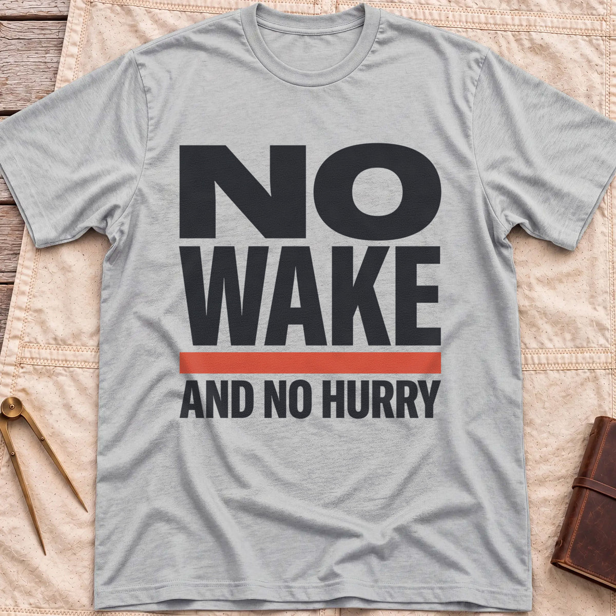 Front view of the sport grey No Wake T-Shirt with the words No Wake in large bold letters over a red bar and the line And No Hurry.