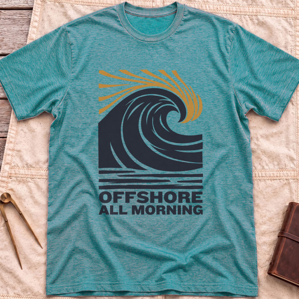 Front view of the heather galapagos blue Offshore All Morning T-Shirt with a curling wave and tan spray lines above striped water and the words Offshore All Morning.