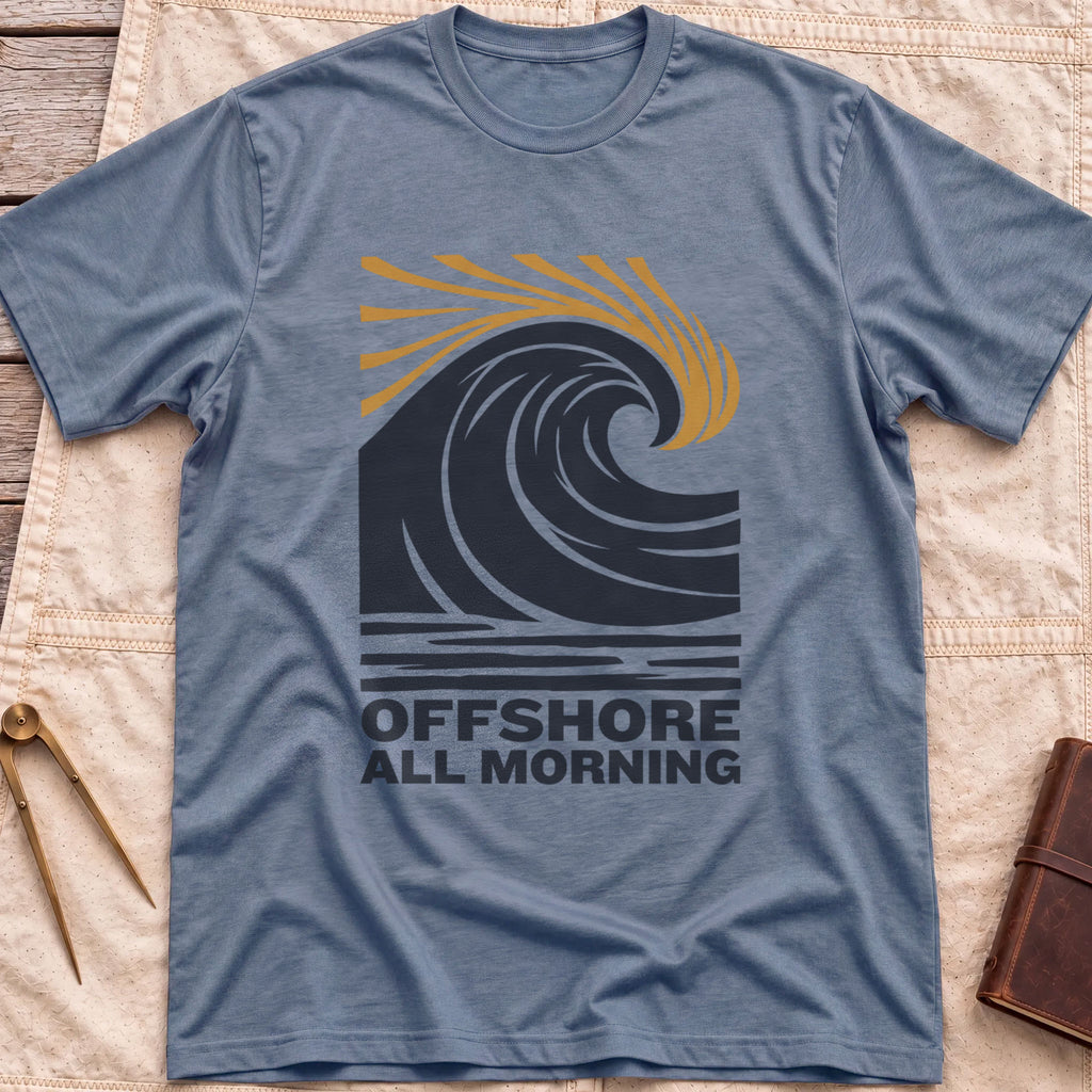 Front view of the heather indigo Offshore All Morning T-Shirt with a curling wave and tan spray lines above striped water and the words Offshore All Morning.