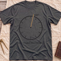 Front view of the dark heather One Degree Off Course T-Shirt with a round dial and a tan needle pointing to 001°.