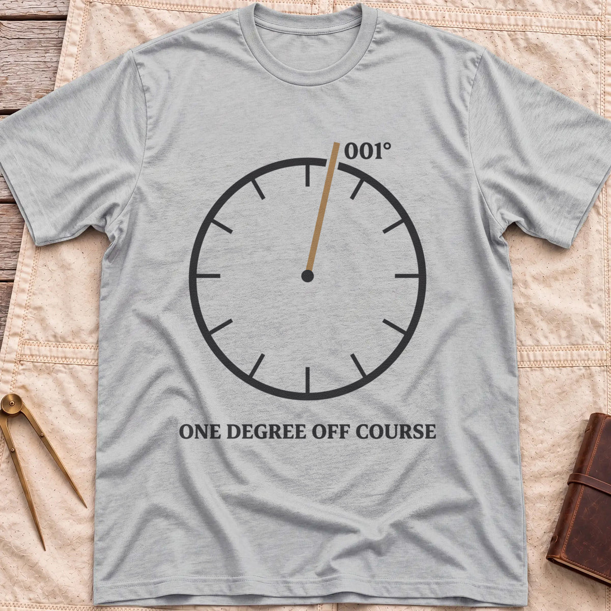 Front view of the sport grey One Degree Off Course T-Shirt with a round dial and a tan needle pointing to 001°.
