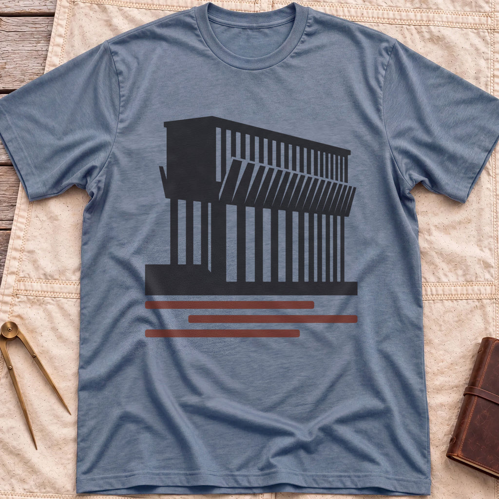 Front view of the heather indigo Ore Dock T-Shirt with a silhouette of an ore dock with a row of angled chutes above red lines.