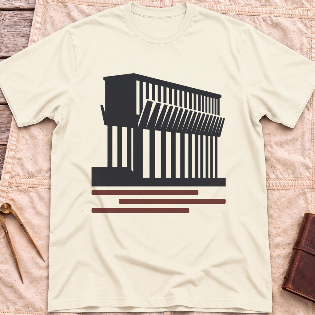 Front view of the natural Ore Dock T-Shirt with a silhouette of an ore dock with a row of angled chutes above red lines.