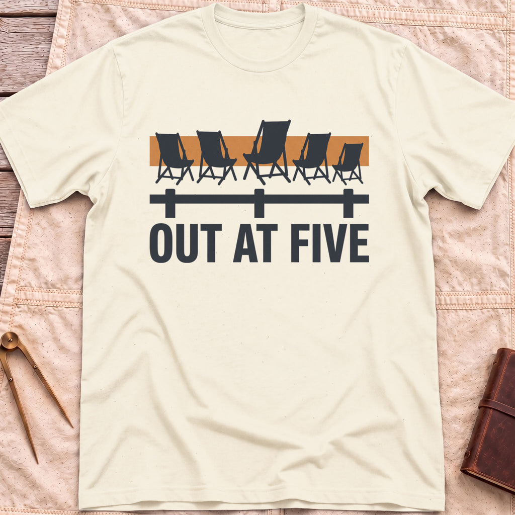 Front view of the natural Out at Five T-Shirt with a row of folding chairs along a dock rail against an orange band, above the words Out at Five.