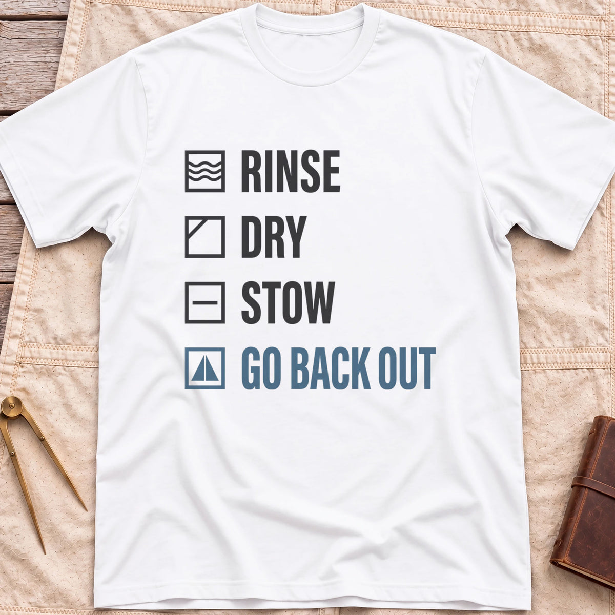Front view of the white Rinse Dry Stow T-Shirt with a checklist reading Rinse, Dry, Stow, Go Back Out, each beside a small icon.