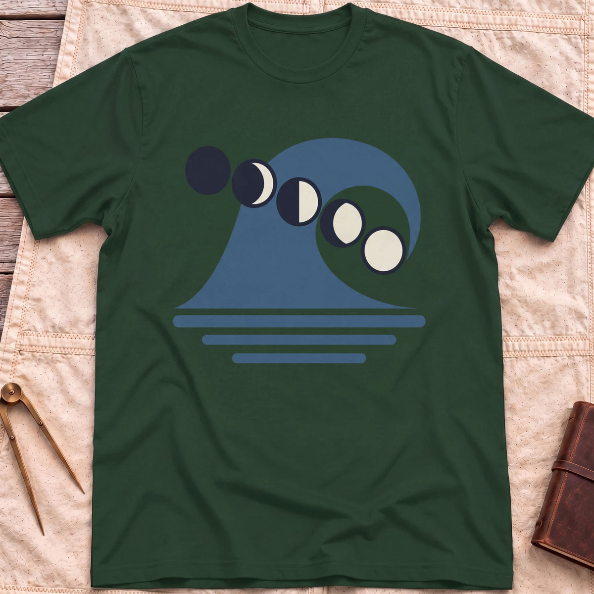 Front view of the forest green Ruled by the Tides T-Shirt with a stylised wave, a row of moon phases and horizontal water lines.