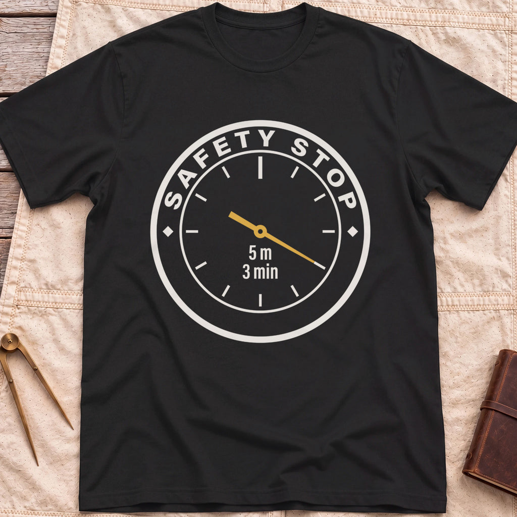 Front view of the black Safety Stop T-Shirt with a round gauge reading Safety Stop around the edge and 5 m, 3 min at the centre.