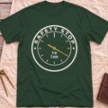 Front view of the forest green Safety Stop T-Shirt with a round gauge reading Safety Stop around the edge and 5 m, 3 min at the centre.