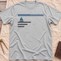 Front view of the sport grey Sea Room T-Shirt with a small sailboat beneath a long scale bar, above three stacked lines.
