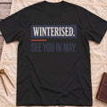 Front view of the black See You in May T-Shirt with the words Winterised. See You in May. in bold condensed type.