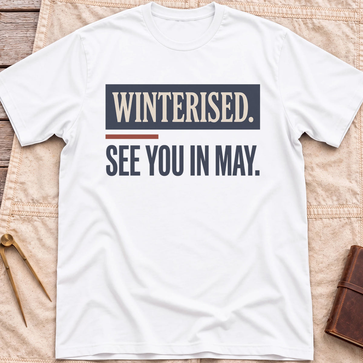 Front view of the white See You in May T-Shirt with the words Winterised. See You in May. in bold condensed type.