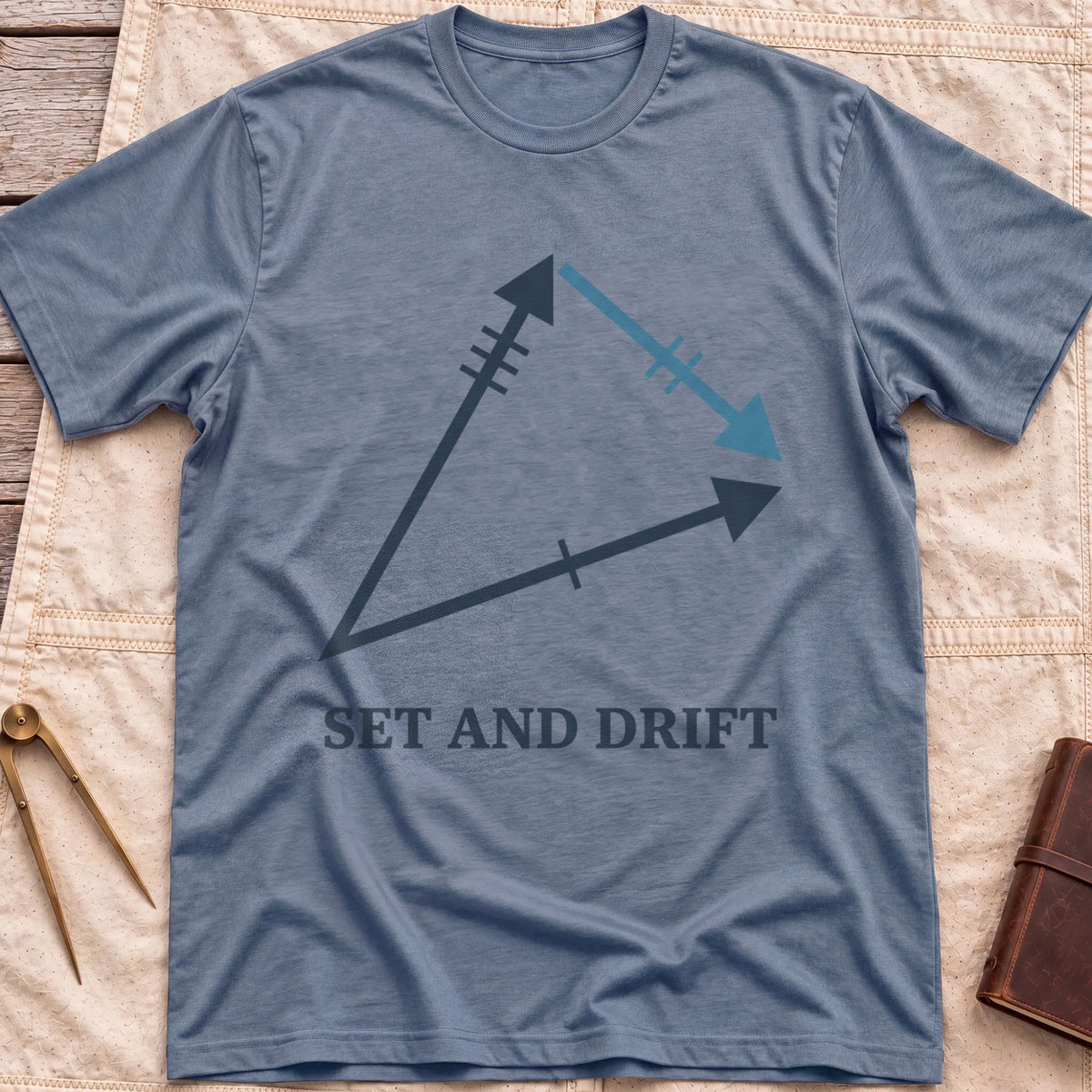 Front view of the heather indigo Set and Drift T-Shirt with a triangle of three arrows marked with tick lines above the words Set and Drift.