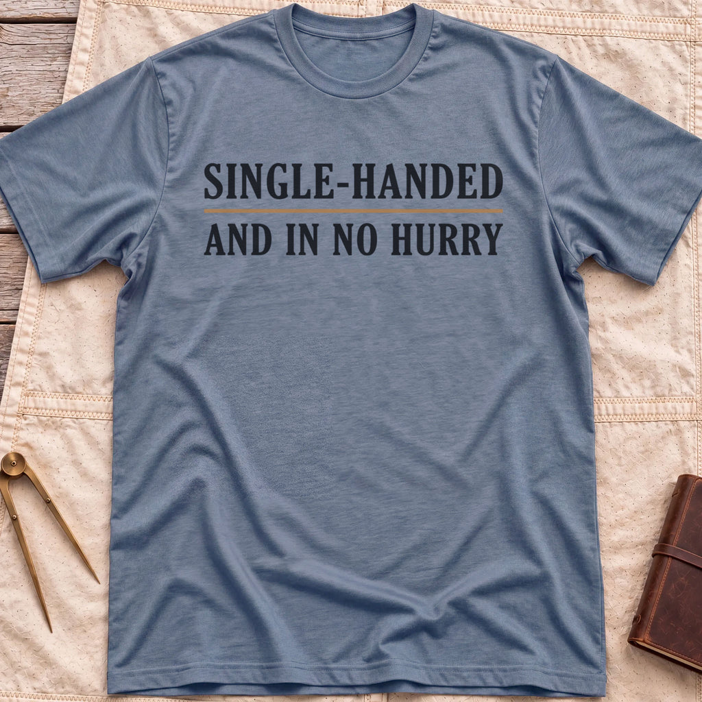 Front view of the heather indigo Single Handed T-Shirt with the words Single-Handed and In No Hurry in serif capitals.