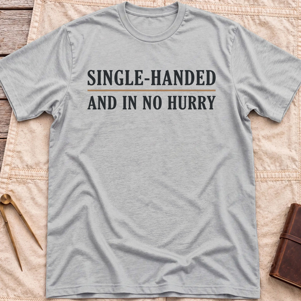 Front view of the sport grey Single Handed T-Shirt with the words Single-Handed and In No Hurry in serif capitals.