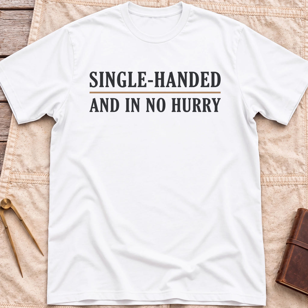 Front view of the white Single Handed T-Shirt with the words Single-Handed and In No Hurry in serif capitals.