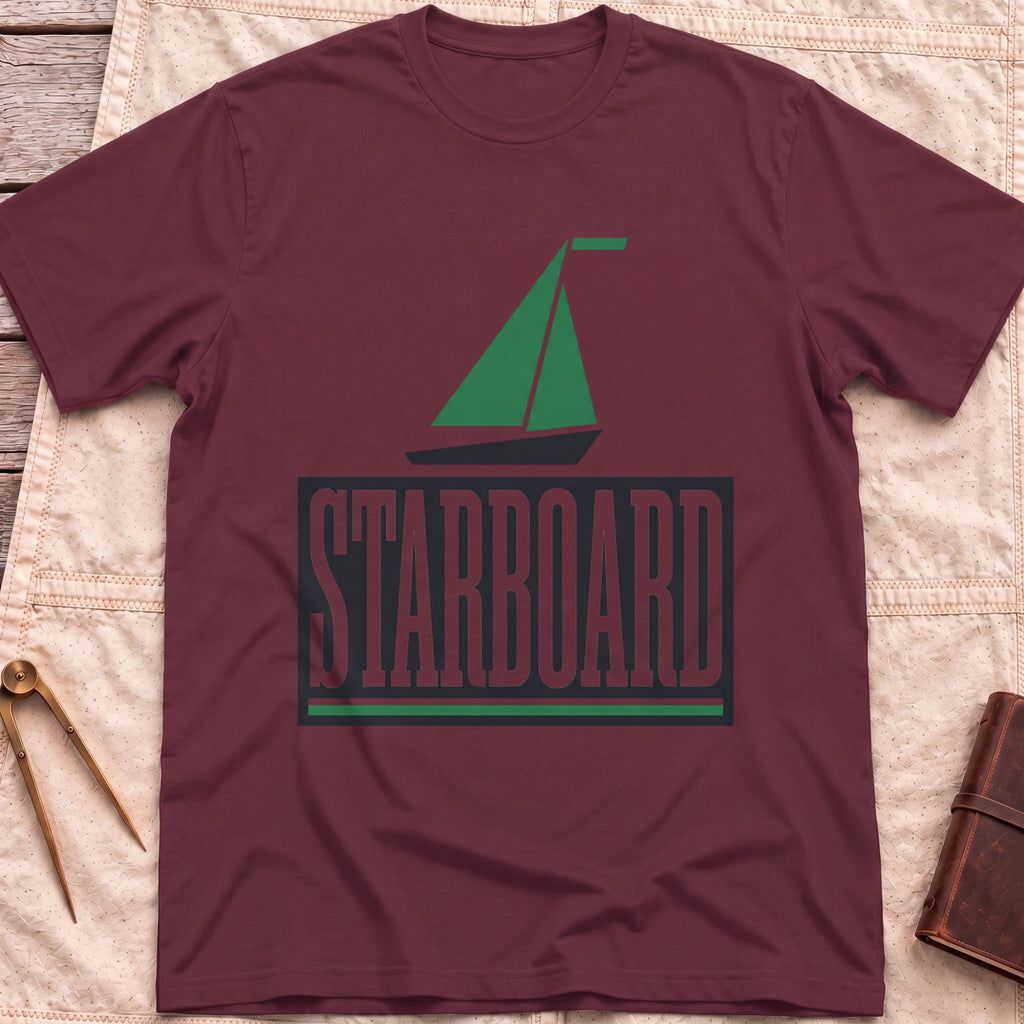 Front view of the maroon Starboard T-Shirt with a green sailboat above the word Starboard in a dark panel.
