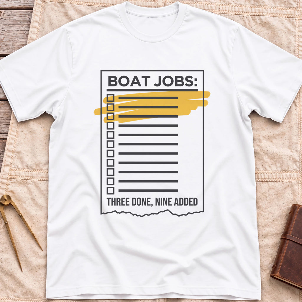 Front view of the white Still on the List T-Shirt with a Boat Jobs checklist, its top items highlighted in yellow, above the words Three Done, Nine Added.