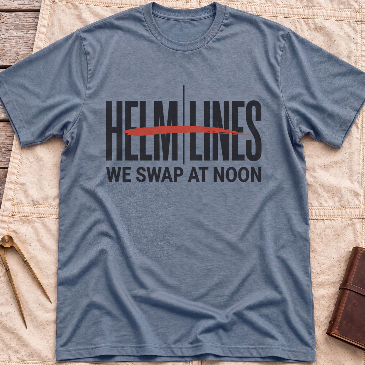 Front view of the heather indigo Swap at Noon T-Shirt with the words Helm and Lines split by a vertical line and a red brushstroke, above We Swap at Noon.