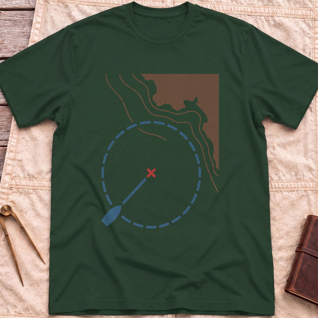 Front view of the forest green Swing Circle T-Shirt with a boat on a line inside a dashed circle around a red cross, beside a stretch of coastline.