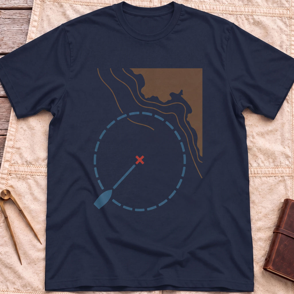 Front view of the navy Swing Circle T-Shirt with a boat on a line inside a dashed circle around a red cross, beside a stretch of coastline.