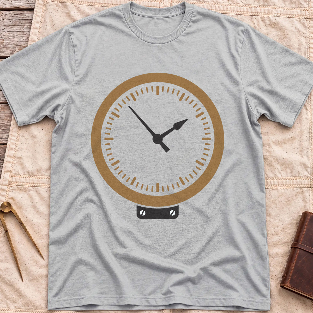 Front view of the sport grey The Glass T-Shirt with a round brass-rimmed dial and two hands on a small mounting plate.