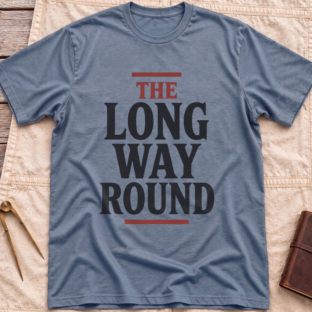 Front view of the heather indigo The Long Way Round T-Shirt with the words The Long Way Round in heavy serif capitals between red rules.