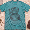 Front view of the heather galapagos blue The Winch T-Shirt with a detailed illustration of a winch wrapped in rope, with its handle.