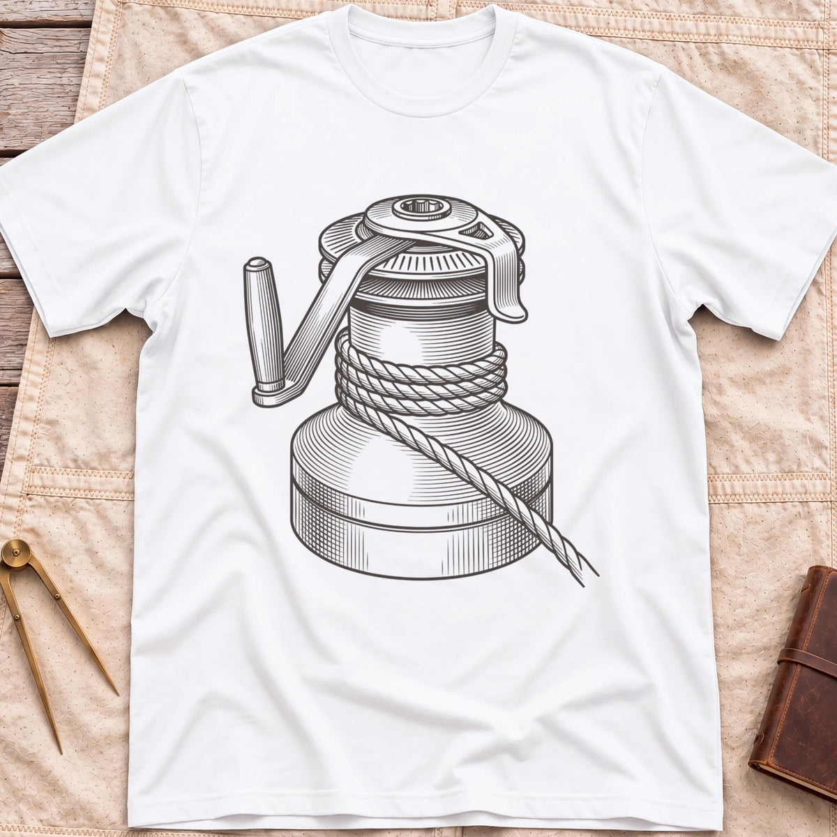 Front view of the white The Winch T-Shirt with a detailed illustration of a winch wrapped in rope, with its handle.